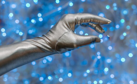 persons hand with water droplets