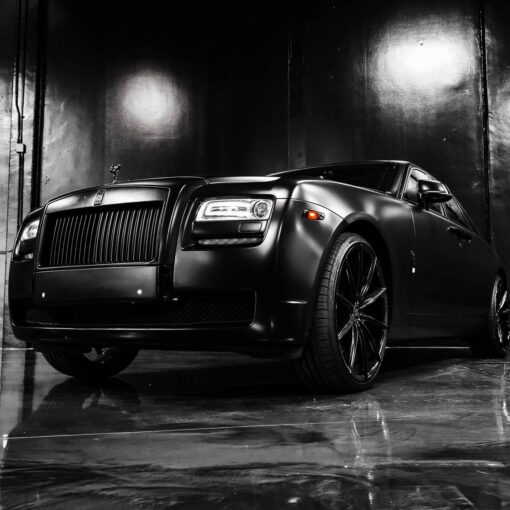 luxury black car parked in modern store