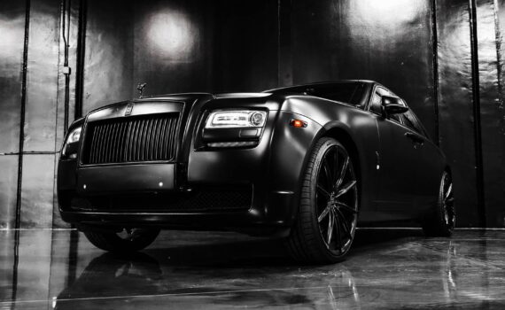 luxury black car parked in modern store