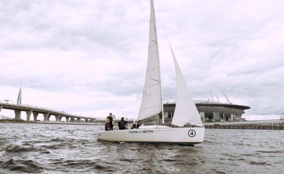 white sail boat on sea