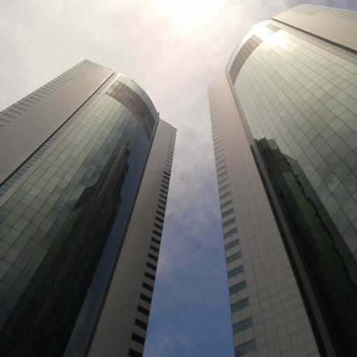 low angle photo of curtain window buildings