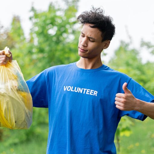 a man holding a bag of plastics