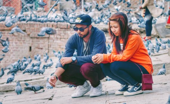 couple gray and orange long sleeved shirts