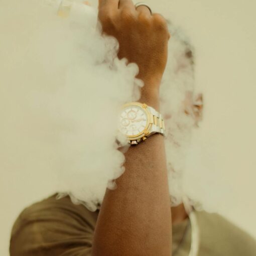 man with his face covered in smoke