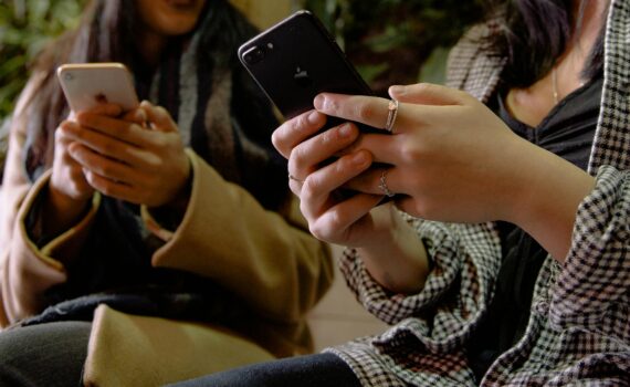 women using their phones
