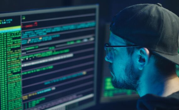 man in blue crew neck shirt wearing black framed eyeglasses