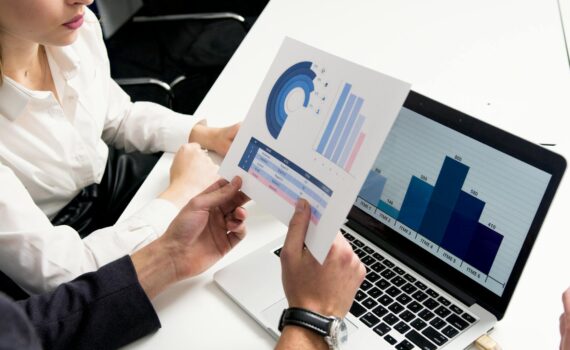 person holding white and blue box