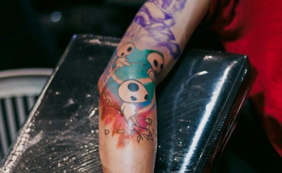 colorful arm tattoo in a studio setting